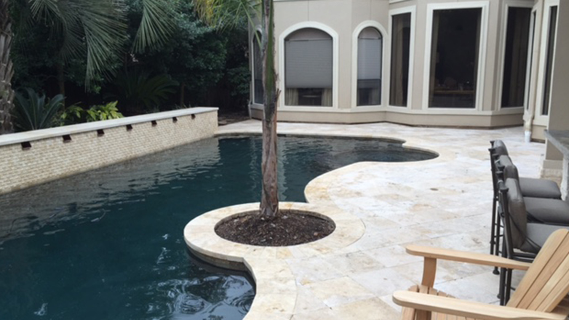 A close-up of beautifully installed pool coping in Houston, showcasing a sleek and durable design by Houston Pool Renovations