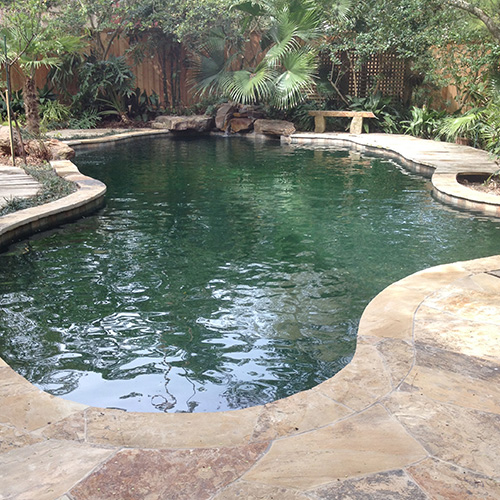 A close-up of beautifully installed pool coping in Houston, showcasing a sleek and durable design by Houston Pool Renovations